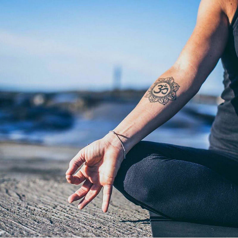 Татуировка знак Ом